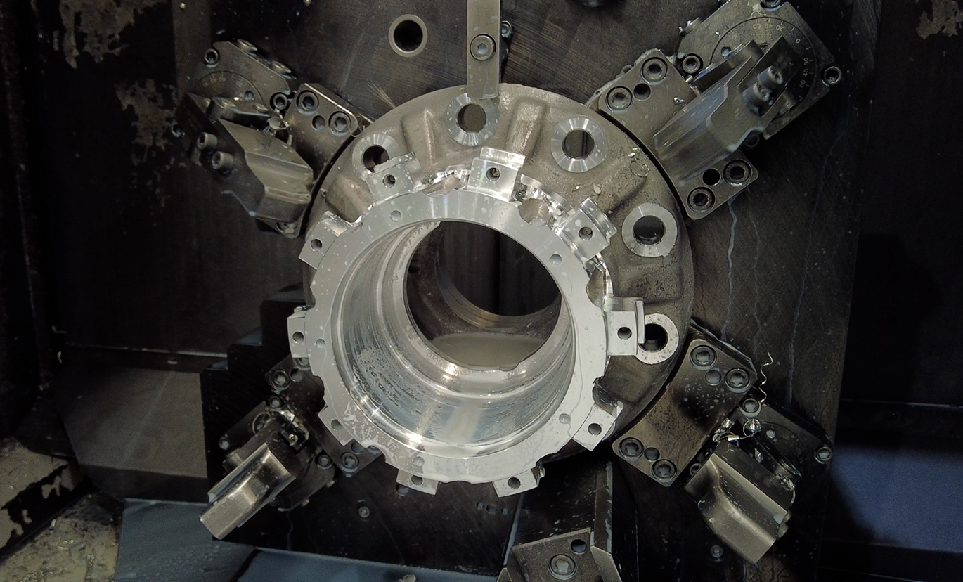 Precision machined aluminum or iron hub castings shown in CNC machine